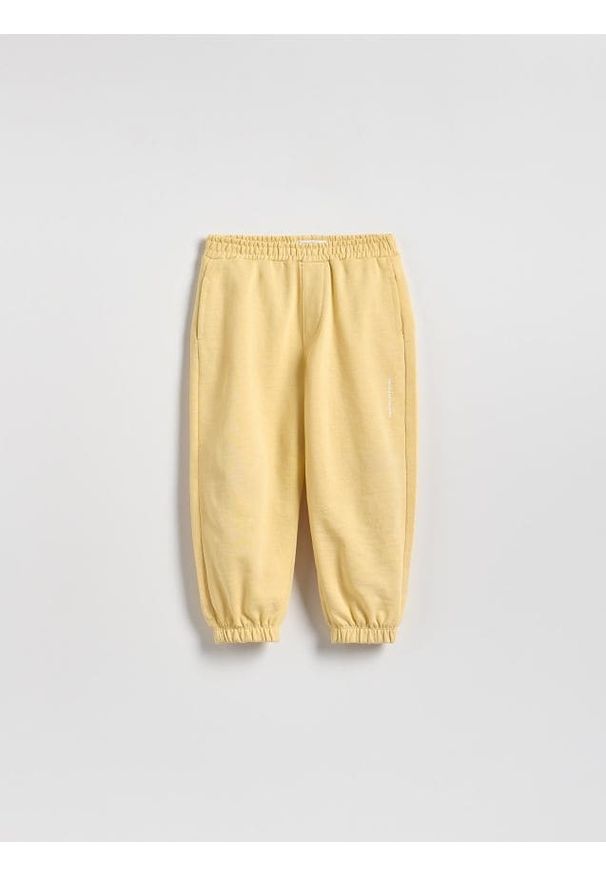 Reserved - Bawełniane spodnie jogger - żółty. Kolor: żółty. Materiał: bawełna