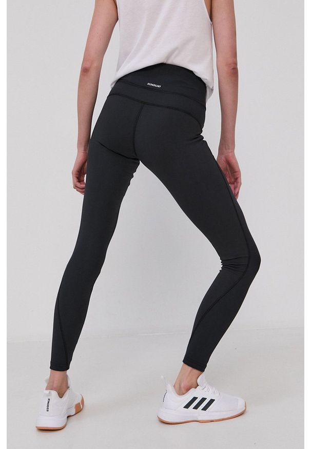 Adidas - adidas Legginsy damskie kolor czarny z nadrukiem. Kolor: czarny. Materiał: dzianina, materiał. Wzór: nadruk