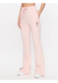 Puma Spodnie dresowe LIBERTY 539832 Różowy Relaxed Fit. Kolor: różowy. Materiał: bawełna