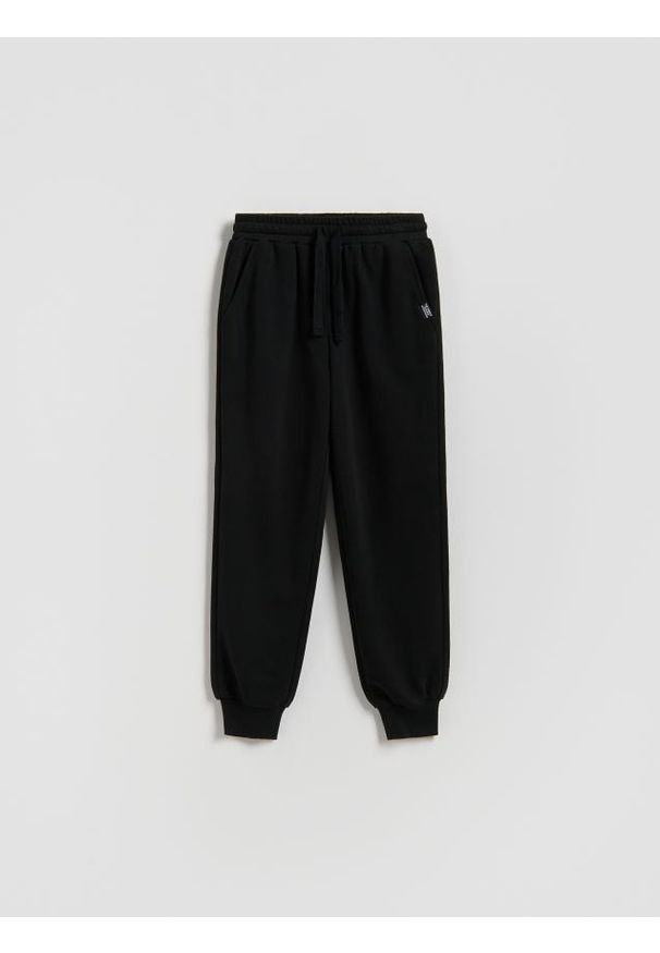 Reserved - Bawełniane spodnie jogger - czarny. Kolor: czarny. Materiał: bawełna