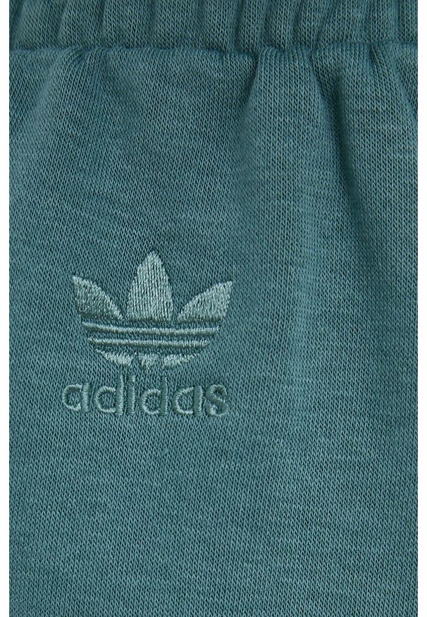 adidas Originals Spodnie Trefoil Moments HE4751 damskie kolor turkusowy gładkie. Kolor: turkusowy. Materiał: bawełna, dzianina, materiał. Wzór: gładki