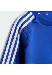 Adidas - Zestaw Essentials 3-Stripes Jogger Kids. Kolor: biały, niebieski, wielokolorowy. Materiał: dresówka, materiał