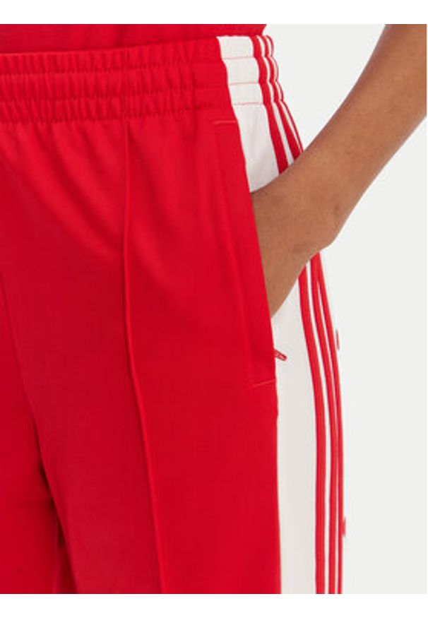 Adidas - adidas Spodnie dresowe Adibreak KD6324 Czerwony Loose Fit. Kolor: czerwony. Materiał: syntetyk