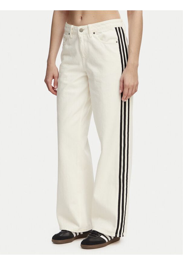 Adidas - adidas Jeansy Firebird KD2895 Beżowy Loose Fit. Kolor: beżowy