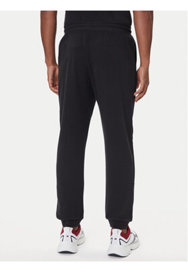 TOMMY HILFIGER - Tommy Hilfiger Spodnie dresowe UM0UM03664 Czarny Regular Fit. Kolor: czarny. Materiał: bawełna