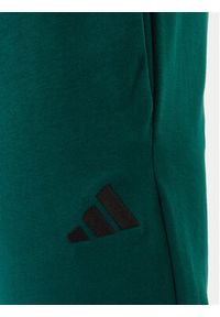 Adidas - adidas Spodnie dresowe Essentials Feel Cozy JE3858 Zielony Regular Fit. Kolor: zielony. Materiał: bawełna #4