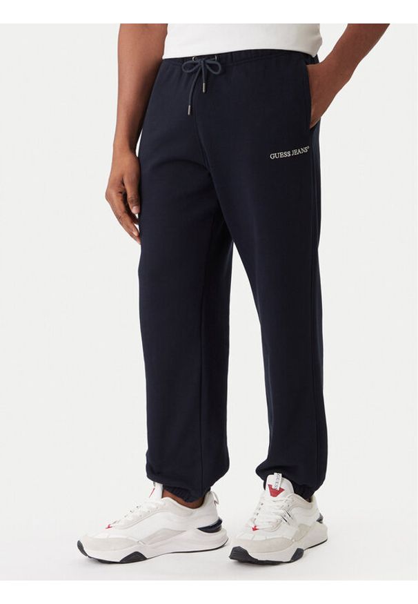 Guess Jeans Spodnie dresowe M6RB70 KCPR1 Granatowy Regular Fit. Kolor: niebieski. Materiał: bawełna