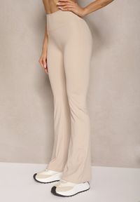 Renee - Jasnobeżowe Legginsy Dzwony High Waist Orruvana. Stan: podwyższony. Kolor: beżowy. Materiał: tkanina