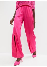 bonprix - Spodnie satynowe z rozcięciem. Kolor: różowy. Materiał: satyna #1