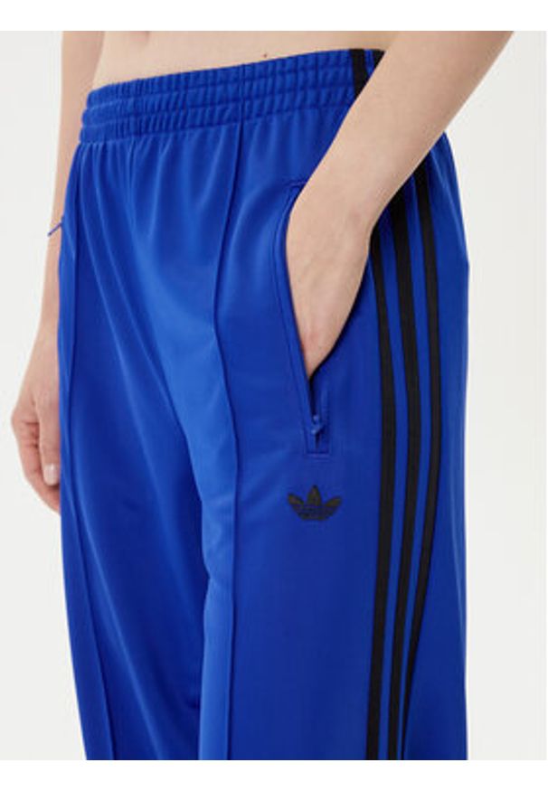 Adidas - adidas Spodnie dresowe adicolor Classic Firebird JY2693 Niebieski Loose Fit. Kolor: niebieski. Materiał: syntetyk