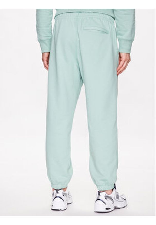 New Balance Spodnie dresowe MP23551 Zielony Relaxed Fit. Kolor: zielony. Materiał: bawełna