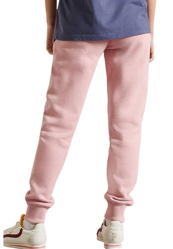 Spodnie dresowe damskie Superdry Pride In Craft joggery. Kolor: różowy. Materiał: bawełna, poliester