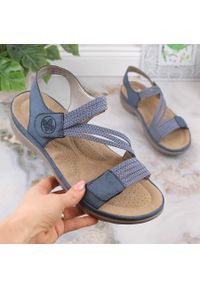 Komfortowe sandały damskie na rzepy niebieskie Rieker 64870-14. Zapięcie: rzepy. Kolor: niebieski. Materiał: skóra ekologiczna