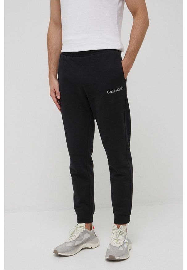 Calvin Klein Performance spodnie dresowe męskie kolor czarny gładkie. Kolor: czarny. Materiał: dresówka. Wzór: gładki