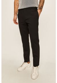 Calvin Klein - Spodnie. Kolor: czarny. Materiał: wełna, bawełna, materiał, elastan, tkanina, poliester. Wzór: gładki #1