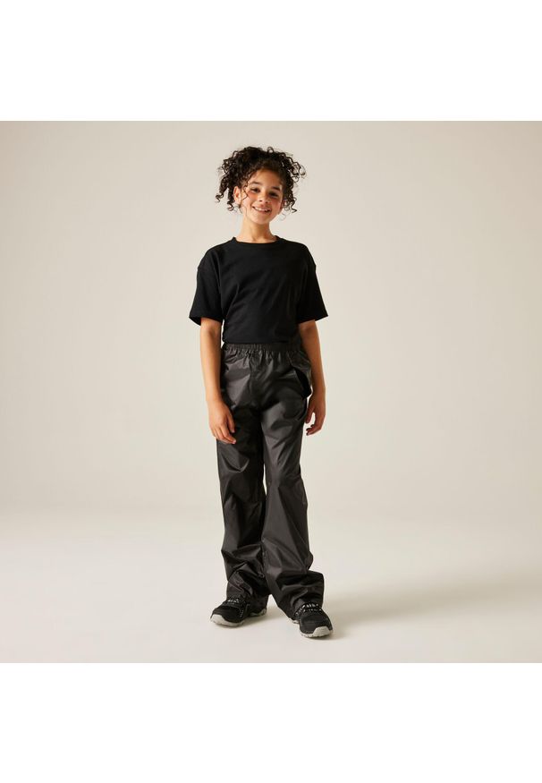 Regatta - Stormbreak Kids Wodoodporne spodnie. Kolor: czarny. Materiał: poliester. Sezon: lato. Sport: turystyka piesza