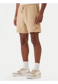 Tommy Jeans Szorty sportowe Signature DM0DM23017 Beżowy Regular Fit. Kolor: beżowy. Materiał: bawełna. Styl: sportowy #1