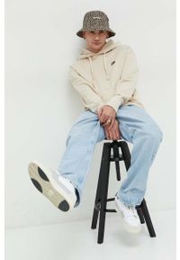 Tommy Jeans bluza bawełniana męska kolor beżowy z kapturem z aplikacją. Typ kołnierza: kaptur. Kolor: beżowy. Materiał: bawełna. Wzór: aplikacja