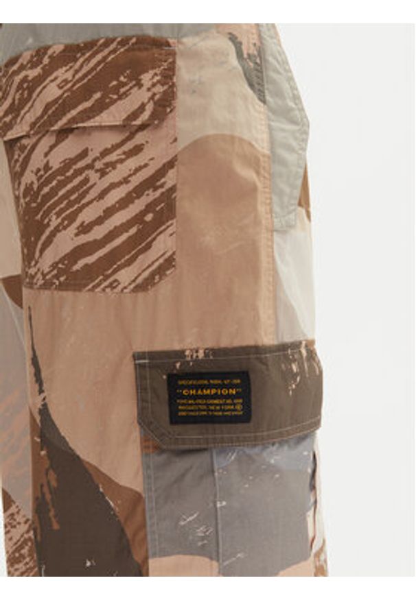 Champion Spodnie dresowe 220414 Beżowy Loose Fit. Kolor: beżowy. Materiał: bawełna