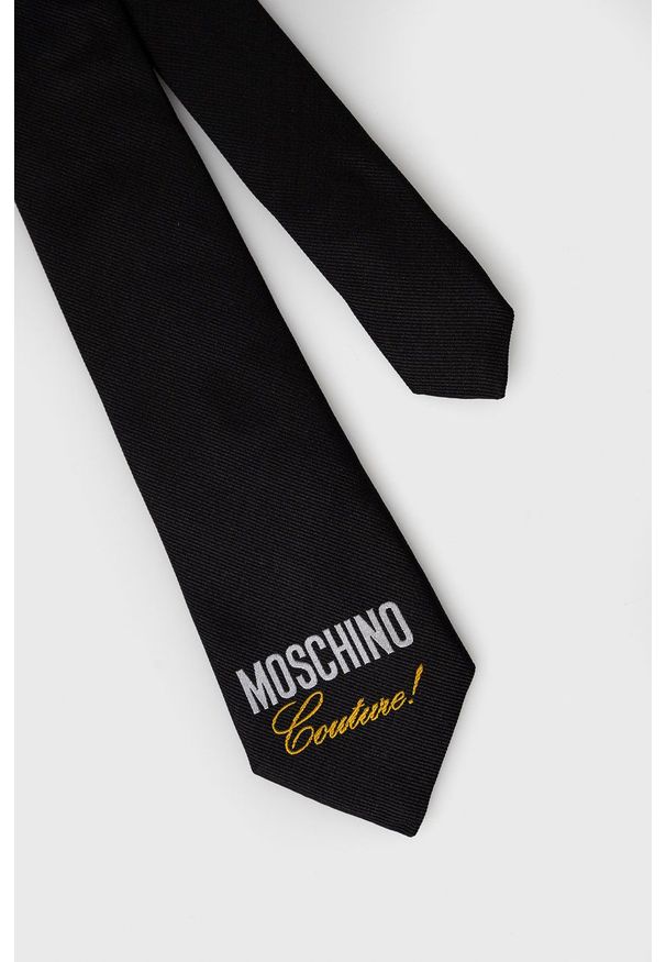 MOSCHINO - Moschino - Krawat. Kolor: czarny. Materiał: materiał. Wzór: gładki