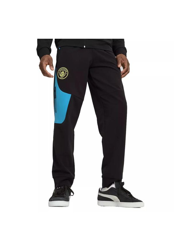 Puma - Spodnie dresowe Manchester City 2024/25. Kolor: niebieski, wielokolorowy, czarny. Materiał: dresówka. Styl: elegancki