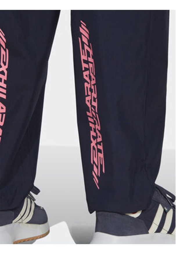 Adidas - adidas Spodnie dresowe Adventure Ride HK4979 Granatowy Loose Fit. Kolor: niebieski. Materiał: dresówka, syntetyk