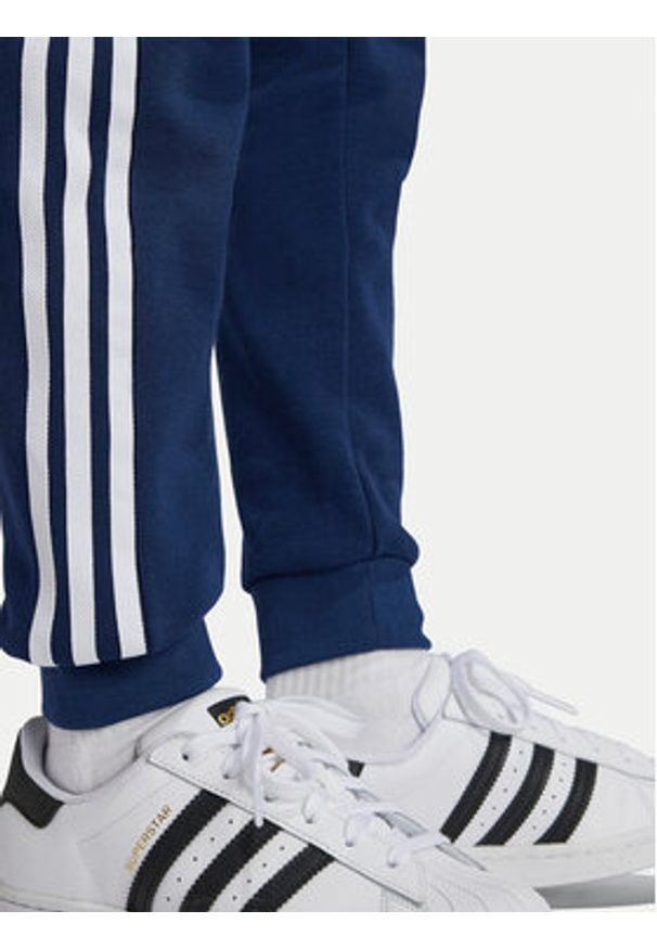 Adidas - adidas Spodnie dresowe Trefoil IY7486 Granatowy Regular Fit. Kolor: niebieski. Materiał: syntetyk