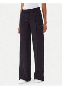 Guess Jeans Spodnie dresowe W5BB04 KC811 Czarny Wide Leg. Kolor: czarny. Materiał: bawełna