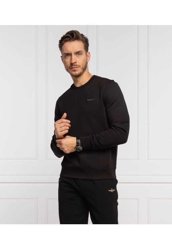 Czarna bluza Aeronautica Militare. Kolor: czarny. Materiał: elastan, bawełna, poliester. Styl: klasyczny