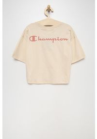 Champion t-shirt bawełniany dziecięcy kolor beżowy. Kolor: beżowy. Materiał: bawełna. Długość rękawa: krótki rękaw. Długość: krótkie. Wzór: aplikacja