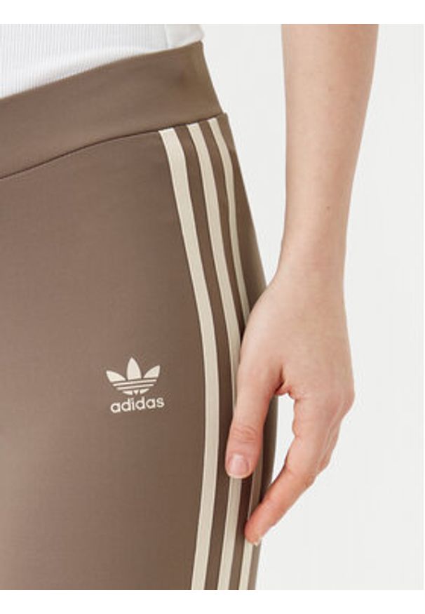 Adidas - adidas Legginsy JD4601 Beżowy Flare Fit. Kolor: beżowy. Materiał: syntetyk