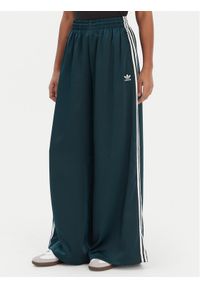 Adidas - adidas Spodnie dresowe adicolor Satin JV7511 Zielony Wide Leg. Kolor: zielony. Materiał: syntetyk #1