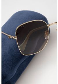 Gucci okulary przeciwsłoneczne damskie kolor złoty. Kolor: złoty. Wzór: geometria #2