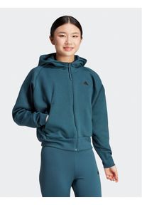 Adidas - adidas Bluza Z.N.E. IN5129 Turkusowy Loose Fit. Kolor: turkusowy. Materiał: bawełna