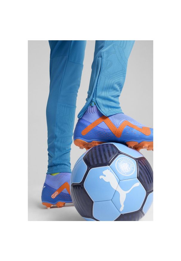 Puma - Męskie spodnie treningowe Manchester City PUMA Magic Blue Yellow Glow. Kolor: wielokolorowy, niebieski, żółty. Sport: piłka nożna
