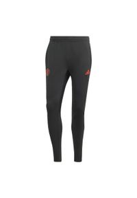 Spodnie do piłki nożnej męskie Adidas Manchester United Tiro 23 Training Pants. Kolor: czarny. Materiał: dresówka, materiał