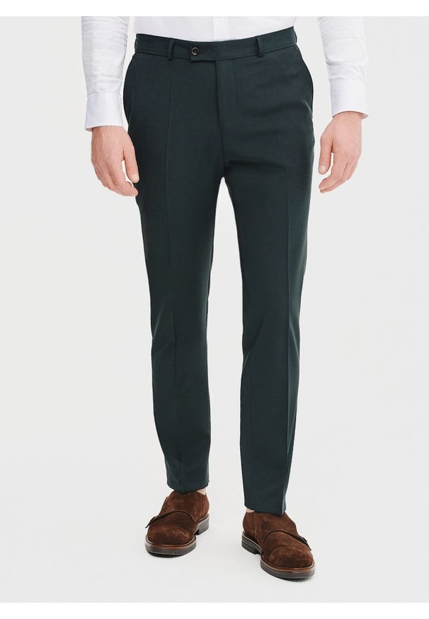 Pako Lorente - PAKO LORENTE – Wełniane spodnie garniturowe w kolorze zielonym. Okazja: na spotkanie biznesowe. Kolor: zielony. Materiał: wełna. Styl: elegancki, biznesowy