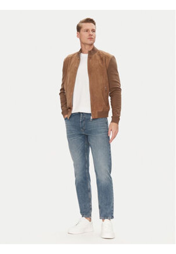 Hugo - HUGO Jeansy 50537705 Niebieski Tapered Fit. Kolor: niebieski