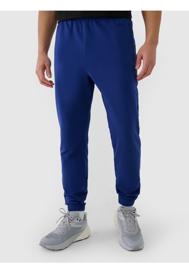 4f - 4F Spodnie dresowe joggery męskie - granatowe 3XL. Kolor: niebieski. Materiał: dresówka. Wzór: ze splotem, gładki
