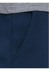 Jack&Jones Junior Spodnie dresowe Gordon 12179798 Granatowy Regular Fit. Kolor: niebieski. Materiał: bawełna