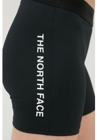 The North Face szorty sportowe Mountain Athletics damskie kolor czarny z nadrukiem medium waist. Kolor: czarny. Materiał: skóra, włókno, materiał. Wzór: nadruk. Styl: sportowy