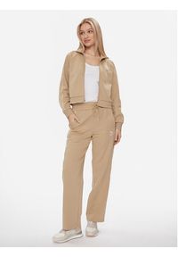 Puma Spodnie dresowe T7 624212 Beżowy Relaxed Fit. Kolor: beżowy. Materiał: syntetyk, bawełna