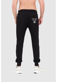 Dolce and Gabbana - DOLCE & GABBANA Czarne spodnie dresowe z haftowanym logo. Kolor: czarny. Materiał: bawełna. Wzór: haft #5