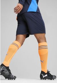 Puma - Męskie szorty treningowe Olympique Marsylia PUMA Club Navy Fluro Orange Pes Blue. Kolor: pomarańczowy, niebieski, żółty, wielokolorowy. Sport: piłka nożna