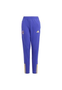 Adidas - Spodnie Real Madrid Tiro 23 Training Kids. Kolor: czarny, fioletowy, wielokolorowy. Materiał: materiał. Sport: piłka nożna