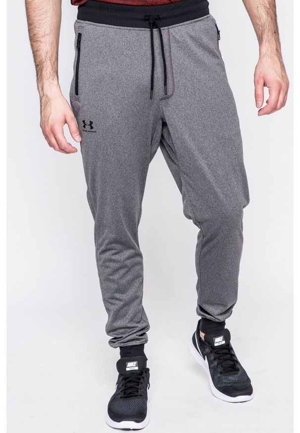 Under Armour - Spodnie Sportstle. Kolor: szary. Materiał: dzianina. Wzór: gładki