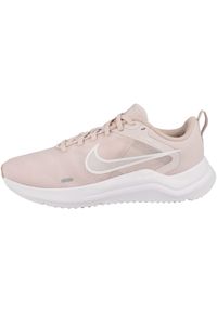 Buty do chodzenia damskie Nike Downshifter 12. Zapięcie: sznurówki. Kolor: różowy. Materiał: tkanina, materiał, syntetyk. Szerokość cholewki: normalna. Model: Nike Downshifter. Sport: turystyka piesza