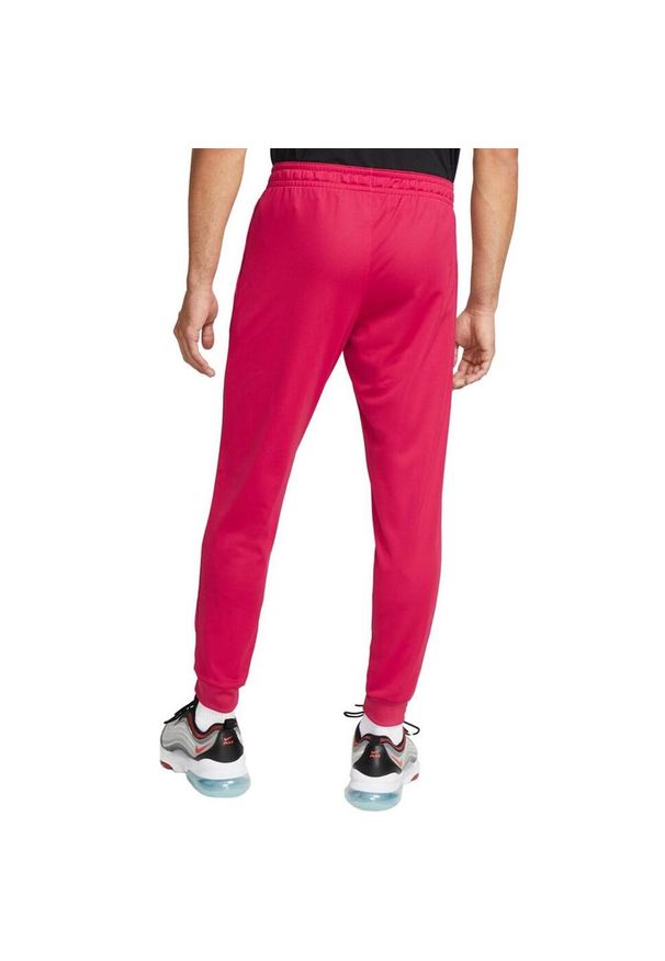 Nike - Męskie Spodnie Do Biegania Libero DriFIT. Kolor: różowy
