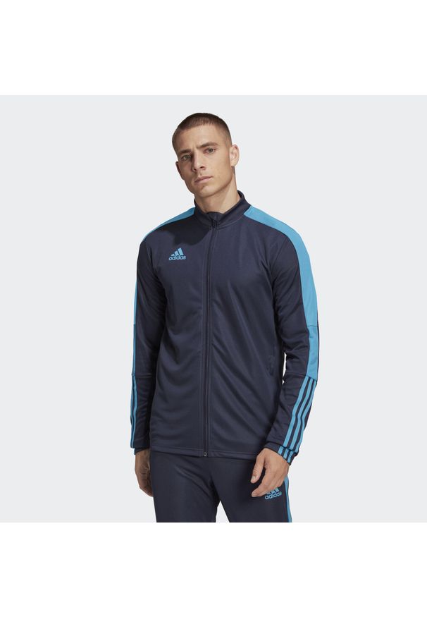 Adidas - Casaco De Futebol Tiro Tk Jkt Es Homem Azul/Azul Real. Kolor: niebieski. Sport: fitness, piłka nożna