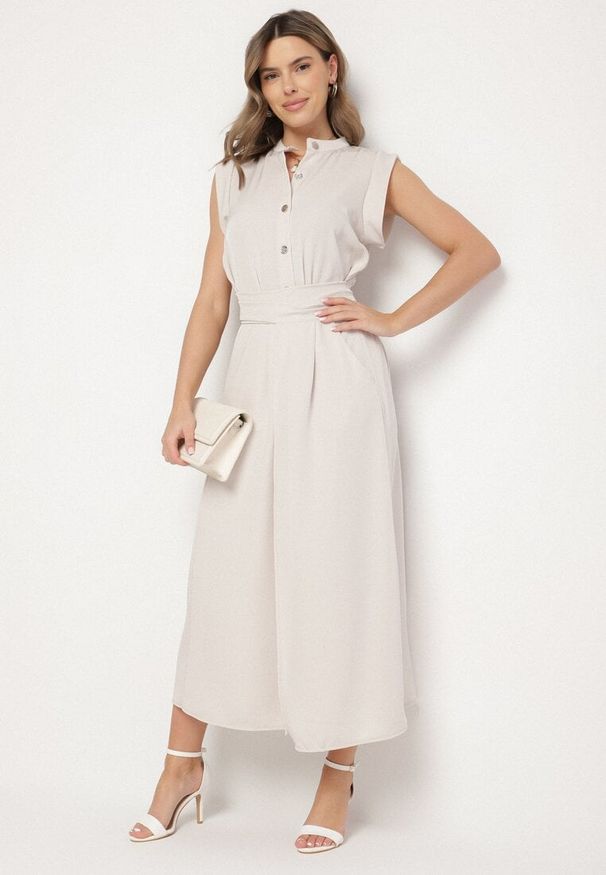 Born2be - Beżowa Sukienka Koszulowa o Rozkloszowanym Kroju z Wiązaniem w Pasie Mavirielle. Okazja: na co dzień. Typ kołnierza: dekolt w serek. Kolor: beżowy. Materiał: skóra. Długość rękawa: długi rękaw. Typ sukienki: koszulowe. Styl: casual, elegancki